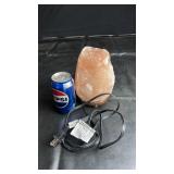 Natural Himalayan salt lamp mounted on a wooden