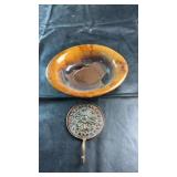 Decorative vintage pottery bowl featuring a rich