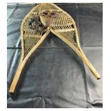 Traditional wooden snowshoes featuring classic