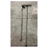 Pair of long-handled garden tools including metal