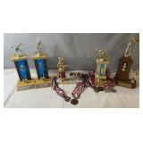 Assorted sports trophies and medals including