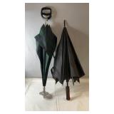 Pair of umbrellas including a classic green plaid