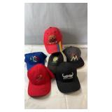 Assorted baseball cap lot featuring a mix of team