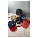 Assorted baseball cap collection featuring