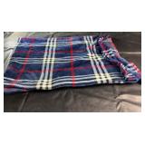Plaid throw blanket in blue, red, and white