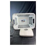 Plastic laundry basket with cutout handles, one