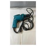 Makita corded electric drill with attached power