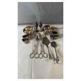 Assorted silver-tone serving pieces including