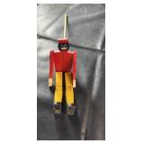Vintage wooden jointed pull toy figure with