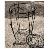 Black metal plant stand with circular top support
