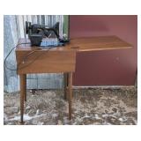 Vintage Spartan sewing machine mounted in a