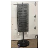 Rotating metal display stand with perforated