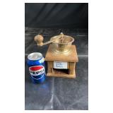 Vintage hand-crank coffee grinder featuring a