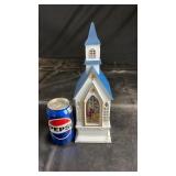 Decorative light-up church with nativity scene