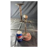 Decorative metal candle holder featuring a