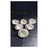 Assorted vintage teacup and saucer set featuring