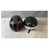 Pair of adult bicycle helmets in black and brown,