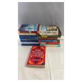 Collection of paperback books including titles by