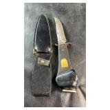 Vintage fixed-blade knife with textured black