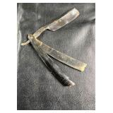 Vintage straight razor with storage case.