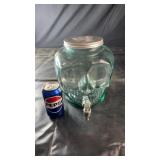 Green glass skull-shaped beverage dispenser with