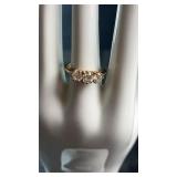 Elegant gold-tone ring set with five clear stones