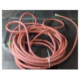 Red Air HoseRed air hose with metal fitting.