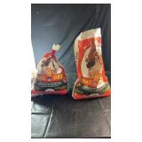Two partially used bags of Stall Dry absorbent