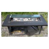 Outdoor propane fire table featuring a black