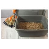Plastic storage tote with lid and partial bag of