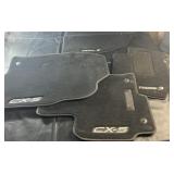 Set of four OEM Mazda carpet floor mats,