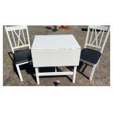 White dining table with two matching chairs