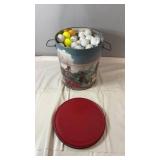 Decorative metal pail filled withgolf balls,