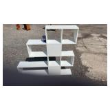 Modern white geometric display shelf featuring an