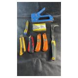 Hand tool lot featuring a heavy-duty staple gun,