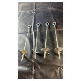 Set of four heavy-duty metal ground anchors with