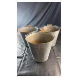 Set of three vintage galvanized metal pails with