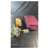 Burgundy heated blanket with yellow heating pad.