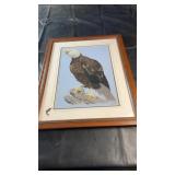 Framed needlepoint artwork depicting a majestic