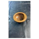 Hand-carved wooden bowl featuring geometric