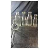 Collection of vintage clear glass milk bottles