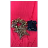 Decorative berry wreath with rustic metal stars,