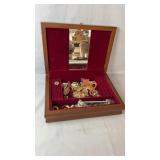 Wooden jewelry box with a red felt-lined interior