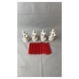 Set of four white angel taper candle holders with
