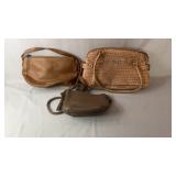 Collection of three womenï¿½s handbags in neutral