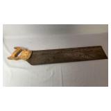 Vintage hand saw measuring approximately 32