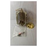 Brass-tone stairwell light fixture with beveled