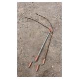 Pair of manual drain augers with crank handles.