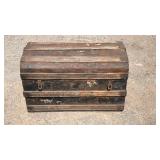 Vintage dome-top steamer trunk with metal banding
