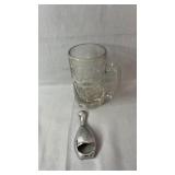 An A&W glass mug and a chrome bowling pin-shaped
